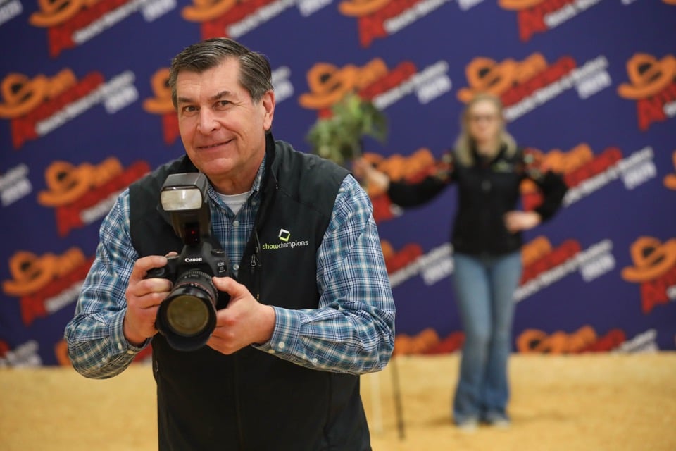 Bruce Keuhl photographing in San Antonio Livestock Show